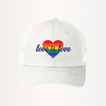 White unisex snapback trucker hat featuring a bold rainbow heart design on the front. The heart is filled with horizontal rainbow stripes, and the words "love is love" are written in elegant white script across it, symbolizing support for LGBTQIA2S+ equality and inclusivity.