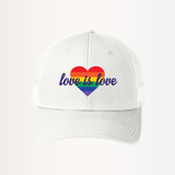 White unisex snapback trucker hat featuring a bold rainbow heart design on the front. The heart is filled with horizontal rainbow stripes, and the words "love is love" are written in elegant white script across it, symbolizing support for LGBTQIA2S+ equality and inclusivity.