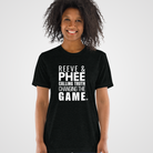 A black unisex T-shirt with bold white lettering that reads “REEVE & PHEE: CALLING TRUTH, CHANGING THE GAME.” Designed by No Assumptions Apparel, this shirt stands in solidarity with WNBA coach Cheryl Reeve and player Napheesa Collier, honoring women who speak truth to power and challenge injustice in sports leadership. The design embodies strength, equity, and activism — merging sport and social justice into a wearable statement.